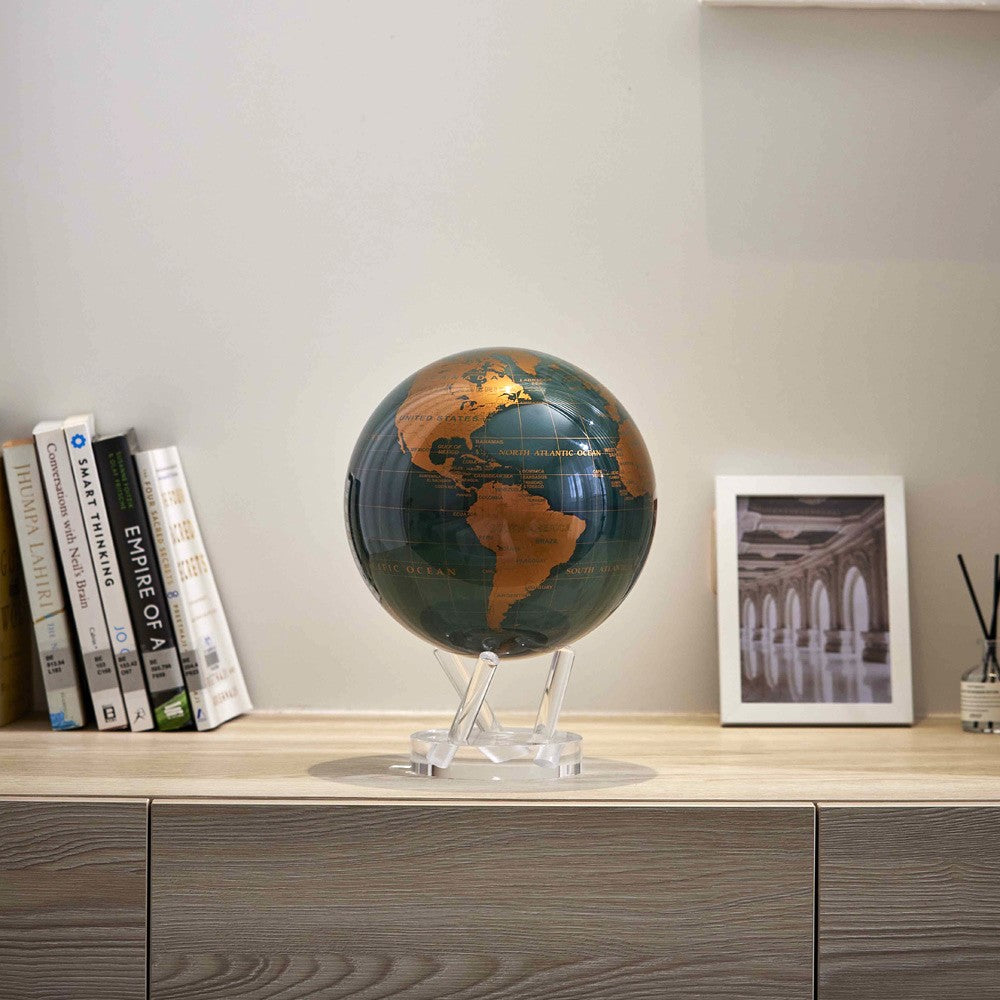 Emerald Green & Gold MOVA Globe displayed on console table modern home decor