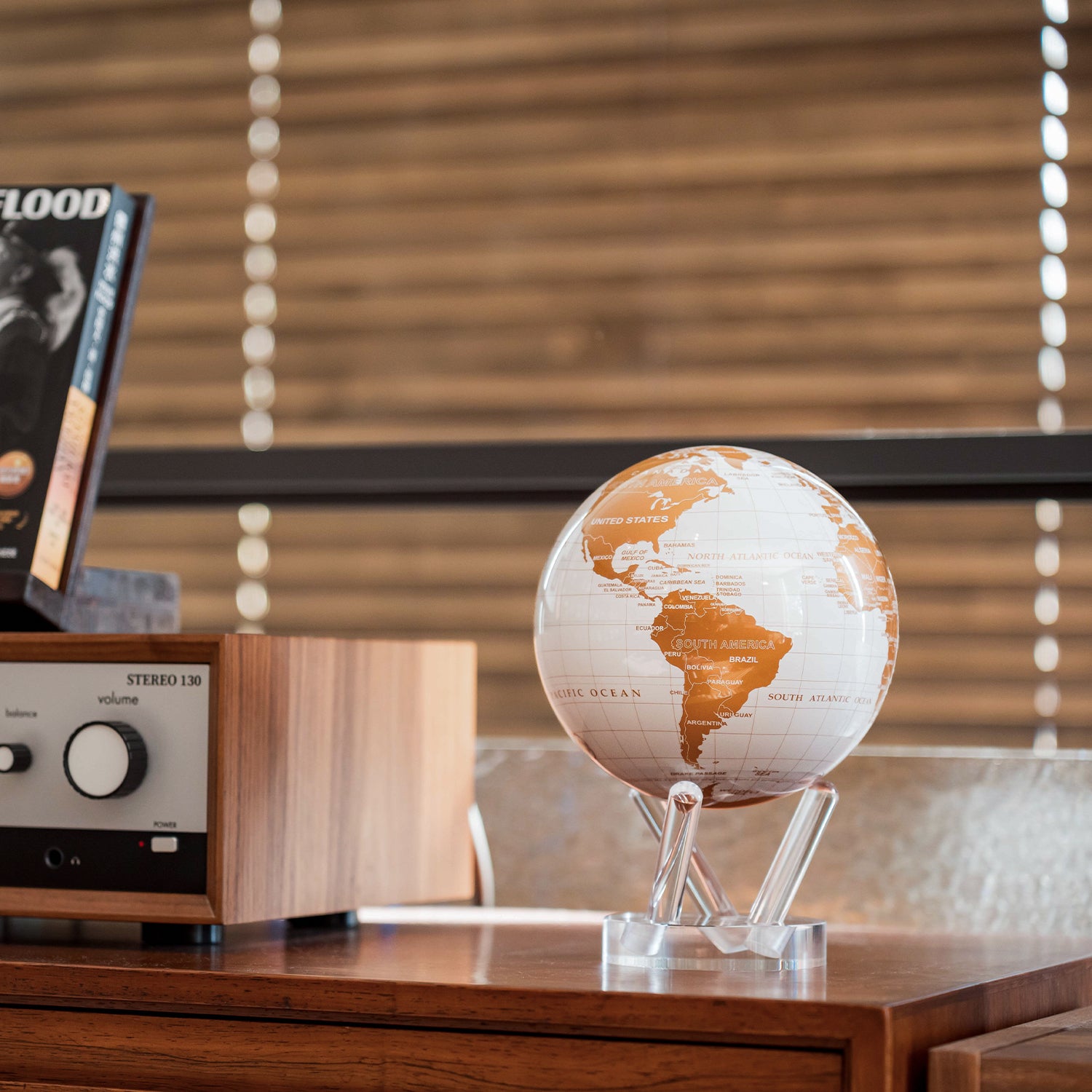 Pearl White & Gold globe on wooden cabinet