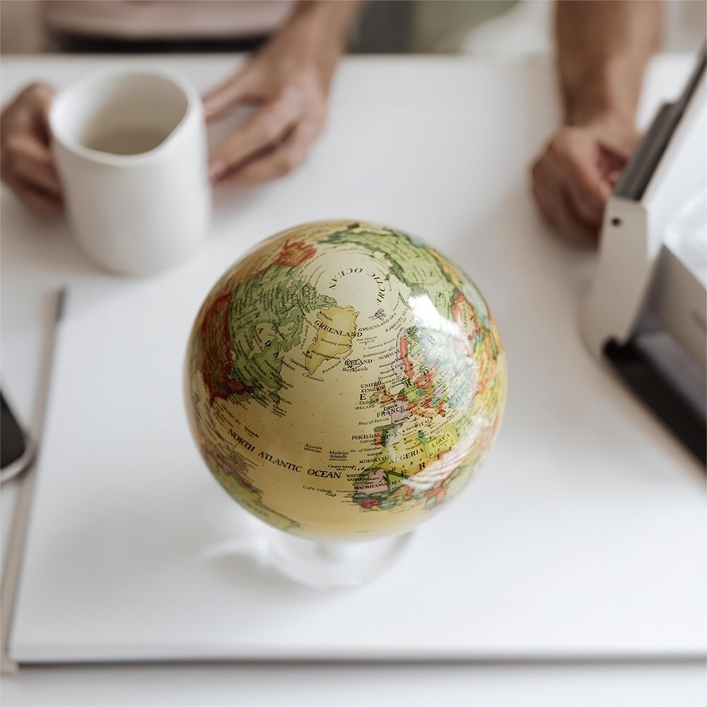 Self-rotating MOVA globe powered by ambient light technology