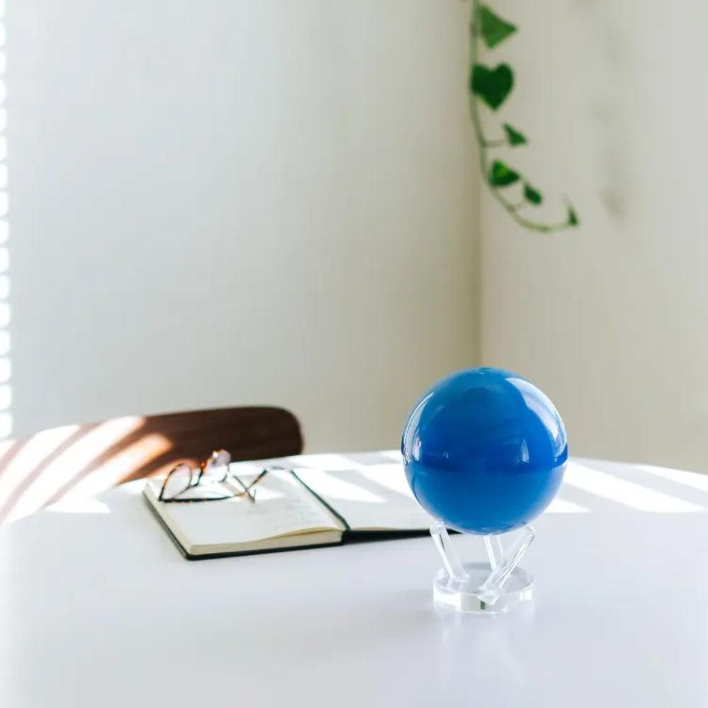 Neptune MOVA Globe displayed on desk with acrylic base home office decor