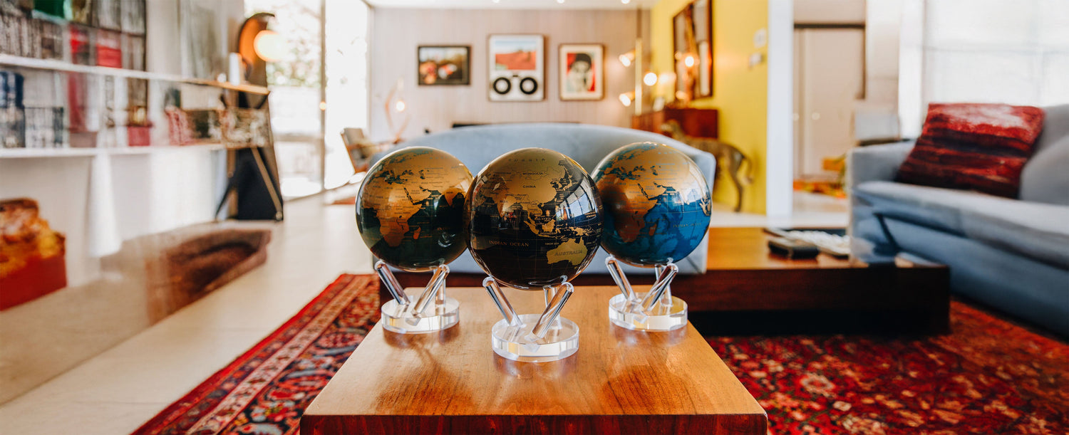 metallic globes on table