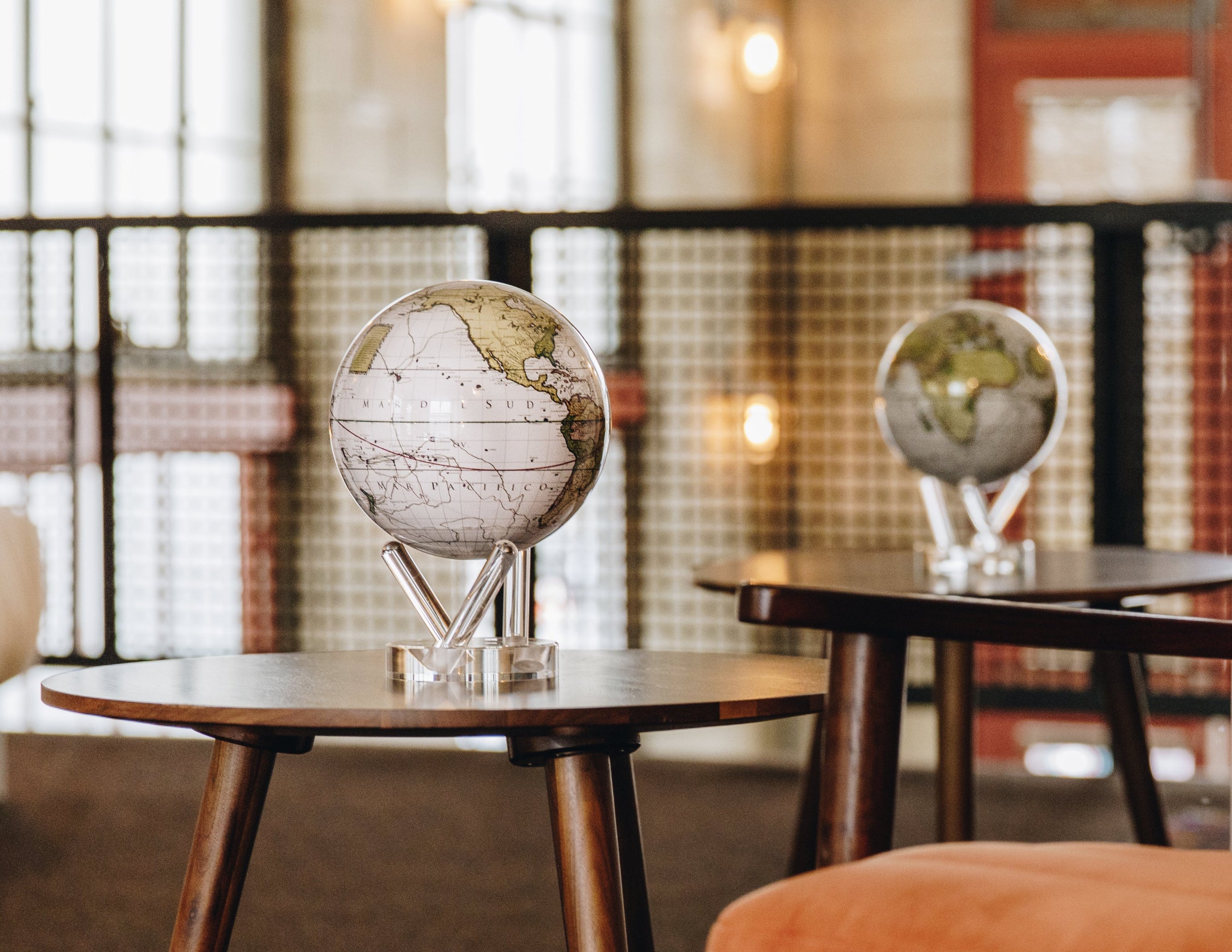 MOVA floating earth globes rotating silently in elegant interior