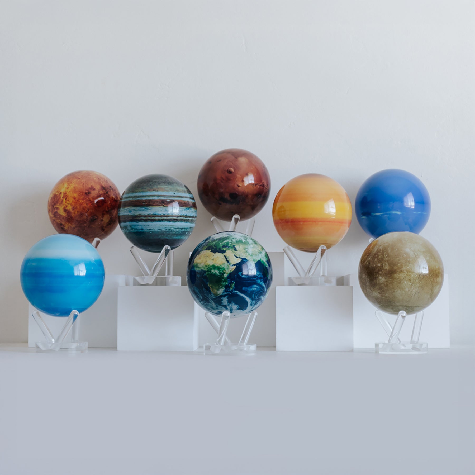MOVA globe collection featuring solar-powered rotating designs