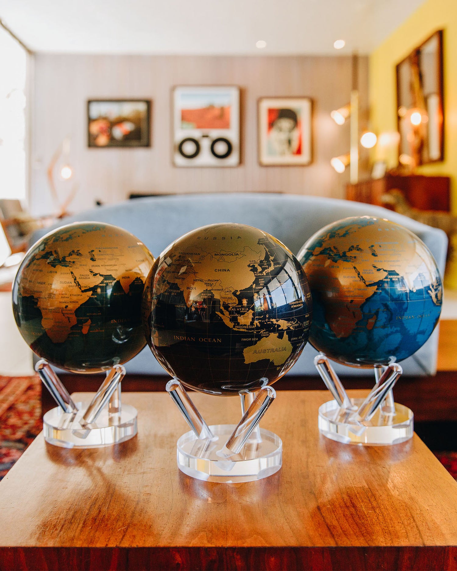 Metallic MOVA globe collection styled for luxury living room décor
