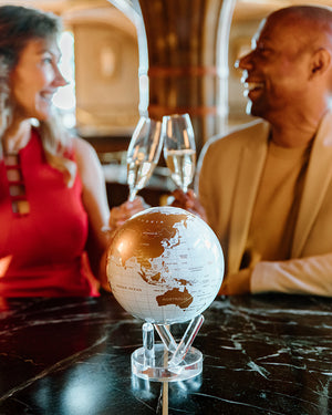 Elegant MOVA globe displayed during a sophisticated evening gathering
