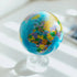 Blue political map MOVA globe with acrylic base in a bright minimalist interior setting