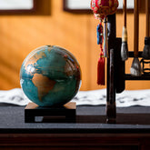 Blue and Gold MOVA rotating globe with gold accents, elegant home decoration and thoughtful travel gift