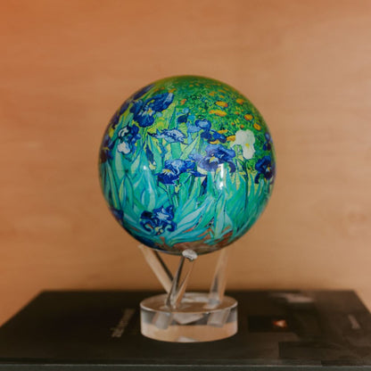 Van Gogh Irises MOVA Globe displayed on a tabletop, featuring vibrant iris artwork and rich colors