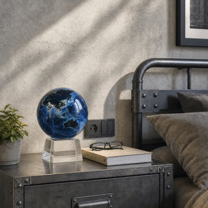 Earth at Night MOVA globe styled in a modern industrial bedroom with contemporary luxury decor accents