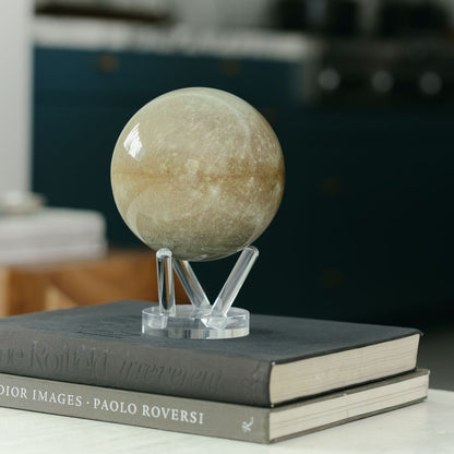 Mercury MOVA Globe displayed on stacked books tabletop decor