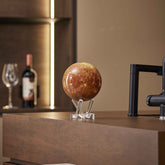 Mercury MOVA Globe displayed on countertop with acrylic base