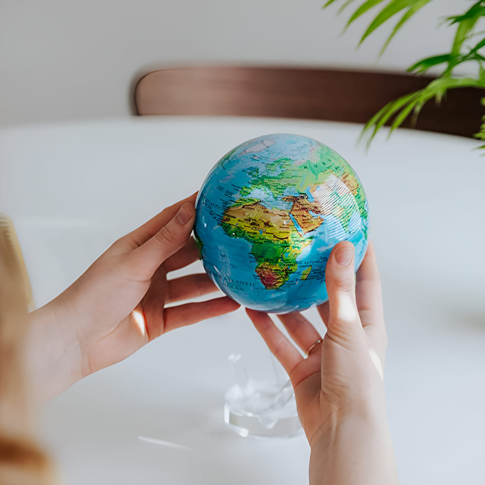 MOVA globe demonstrating magnetic rotation and dual-layer technology