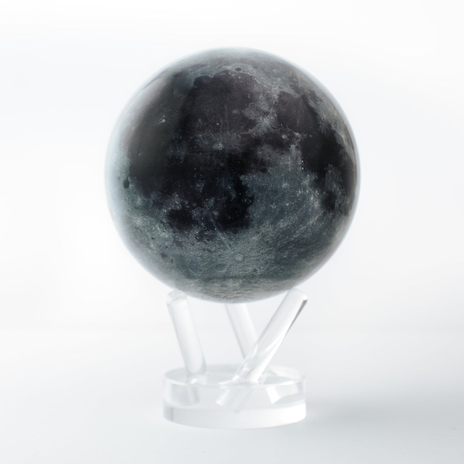 Close-up of MOVA Moon rotating globe on clear stand, detailed lunar landscape for astronomy decor and cosmic gift