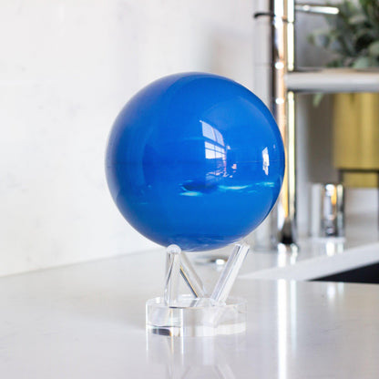 Neptune MOVA Globe on countertop featuring vibrant blue planet imagery
