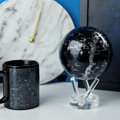 Constellations MOVA Globe beside decorative accents, inspired by NASA imagery of the night sky