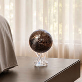 Constellations MOVA Globe displayed on a bedside table, featuring all 88 recognized star constellations