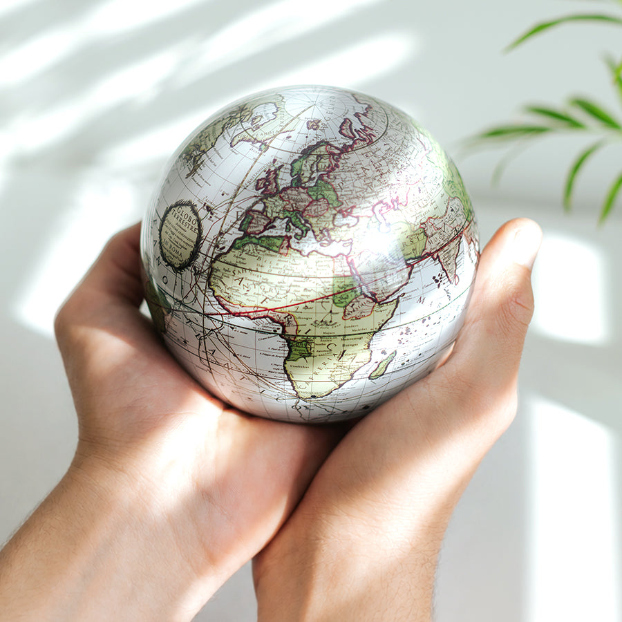 MOVA globe held as a thoughtful luxury gift