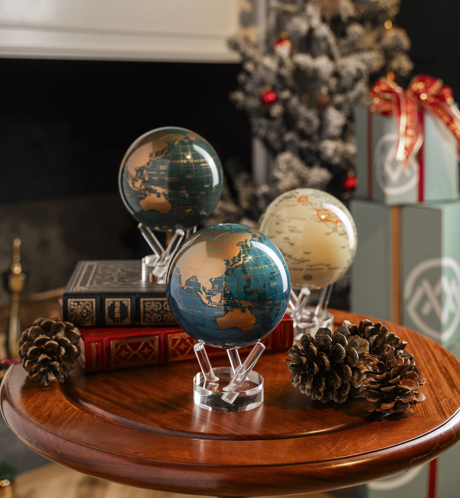 Metallic MOVA globe collection displayed in elegant holiday decor