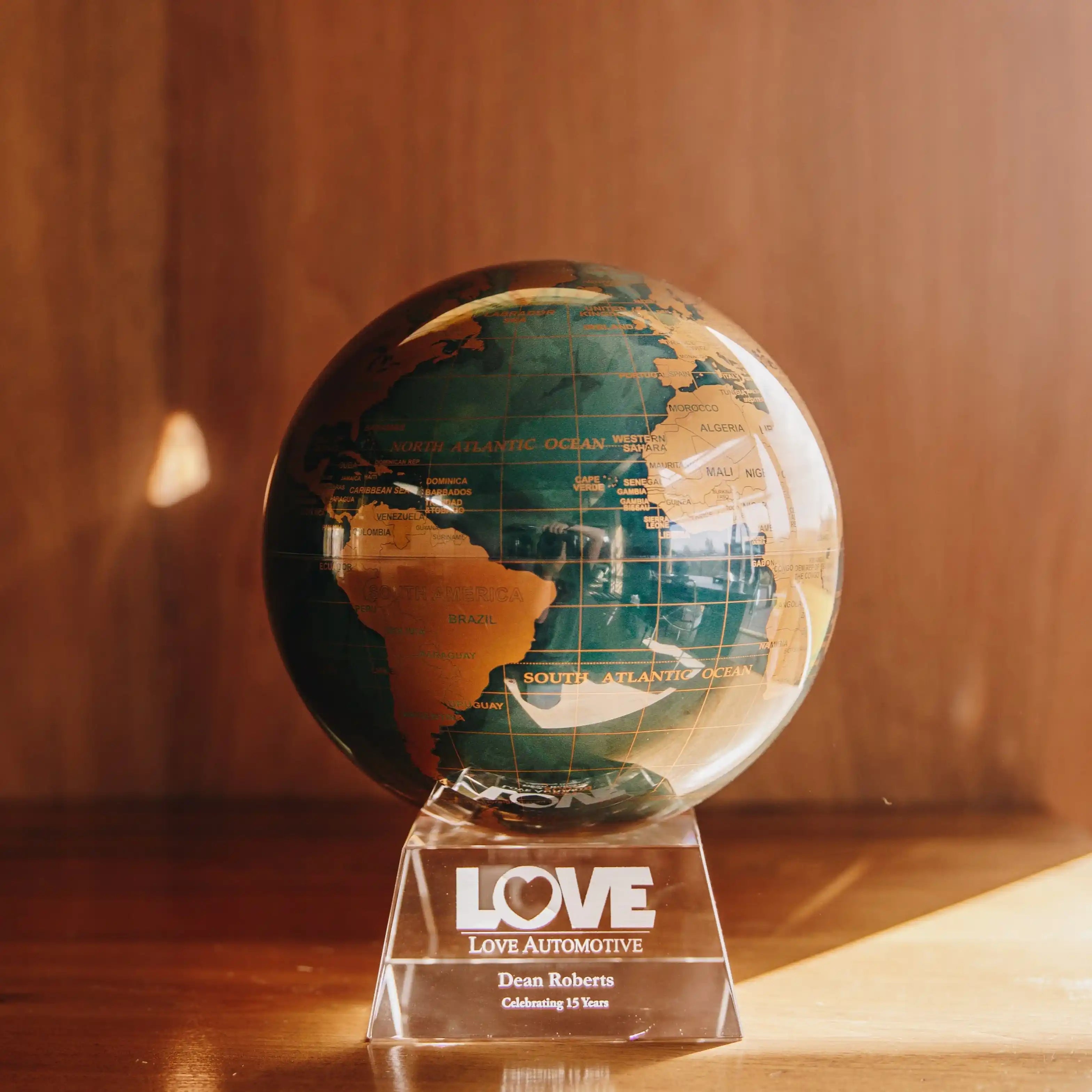 Customized MOVA globe base engraved with personalized company branding