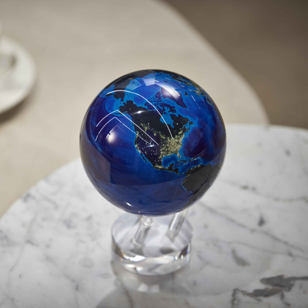 Earth at Night MOVA Globe with crystal base on a marble tabletop