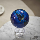Earth at Night MOVA Globe with crystal base on a marble tabletop