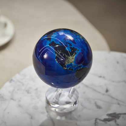 Earth at Night MOVA Globe with crystal base on a marble tabletop