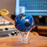 Earth at Night MOVA Globe on a wooden desk in a contemporary workspace