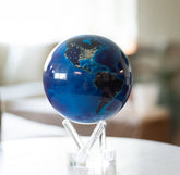 Earth at Night MOVA Globe showcasing illuminated city lights in a modern living room setting