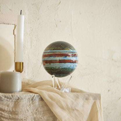 Jupiter MOVA Globe displayed on table with acrylic base space decor