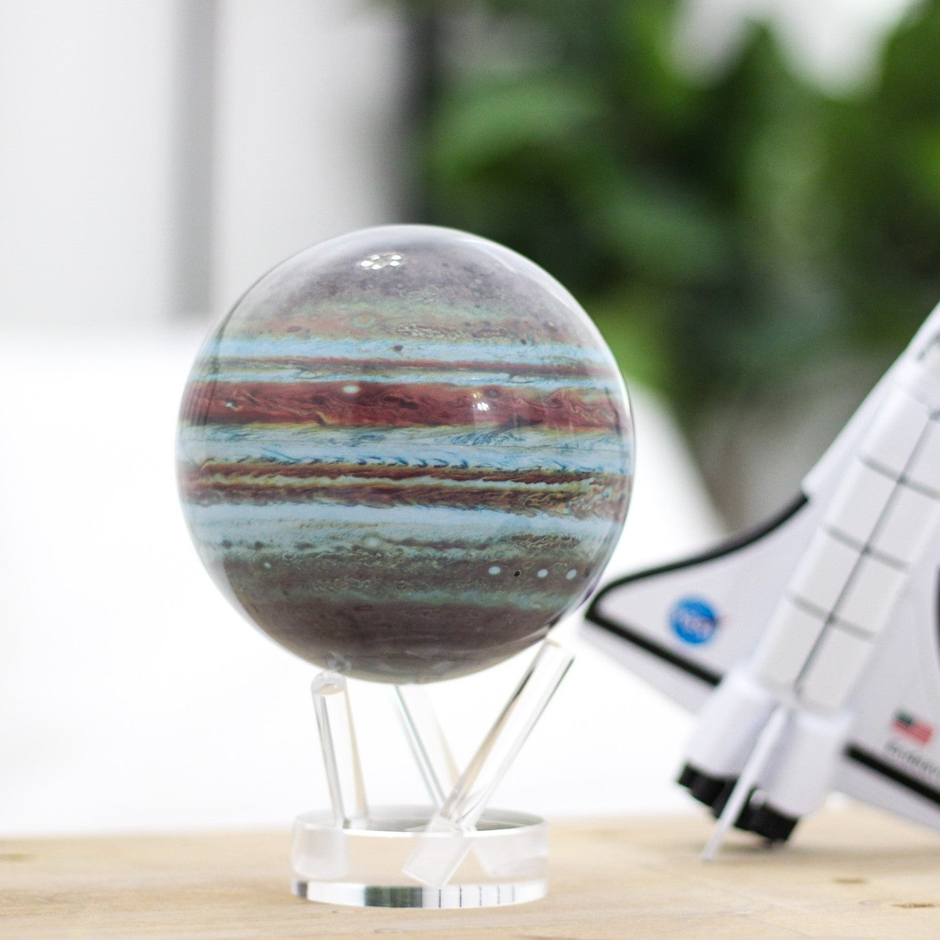 Jupiter MOVA Globe on desk beside model space shuttle