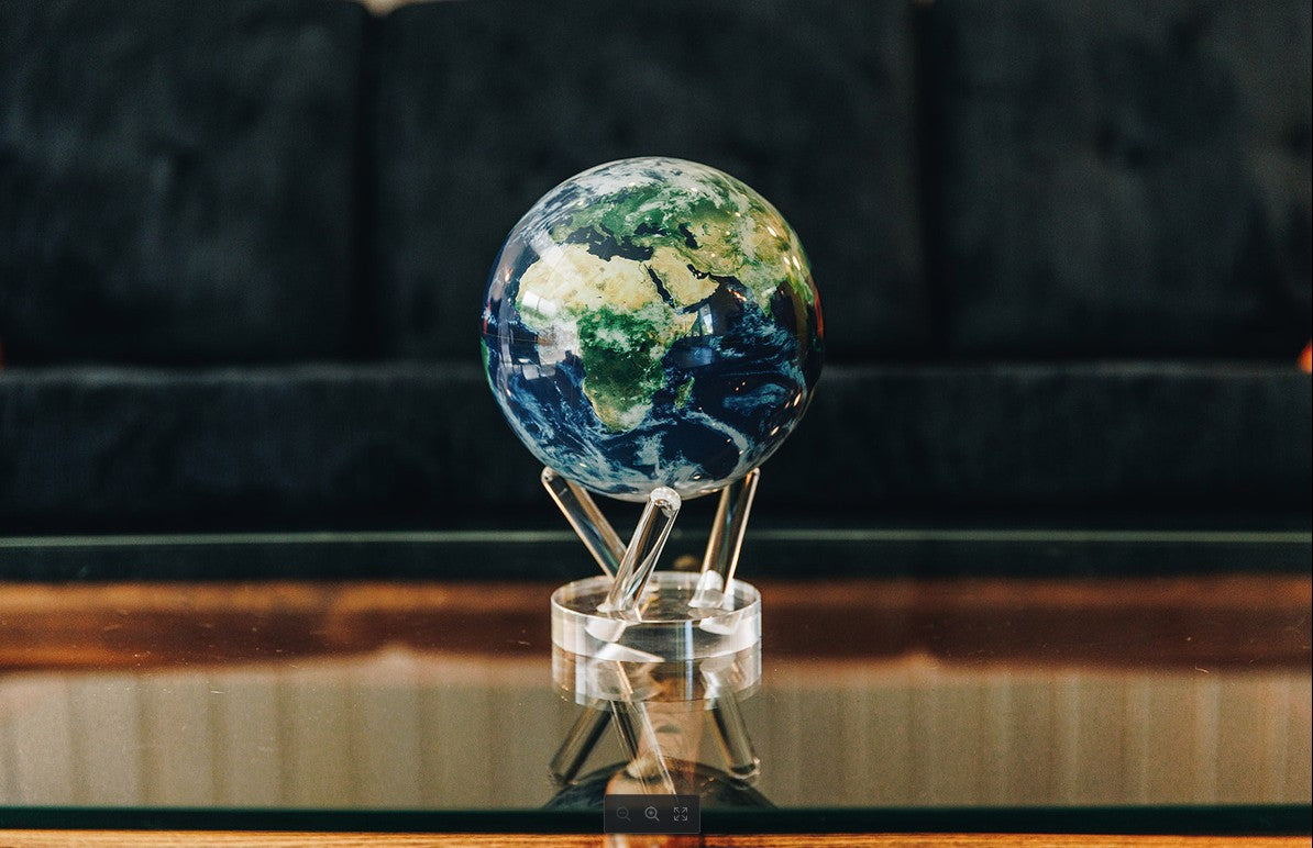 Self-rotating MOVA earth globe styled for luxury office décor