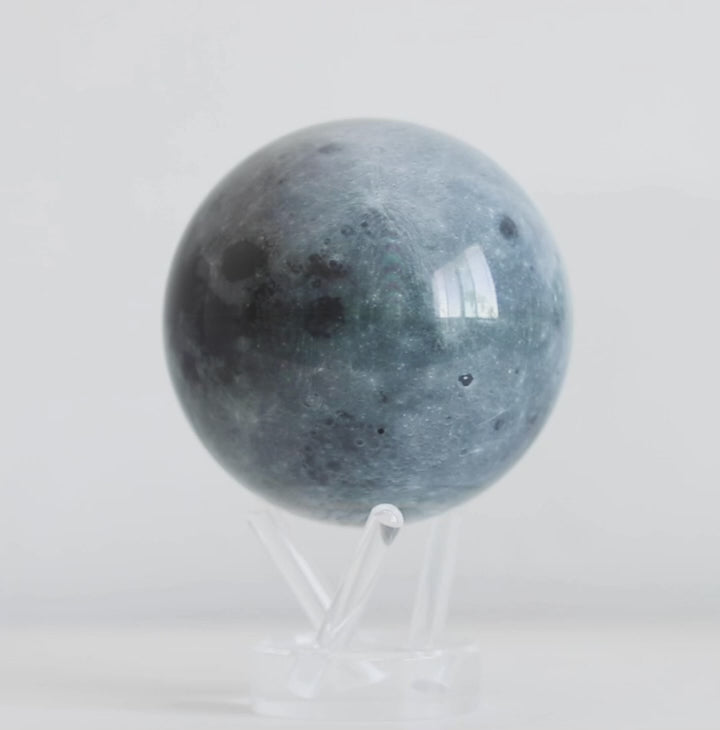 Moon MOVA globe rotating smoothly on acrylic base in lunar inspired product video