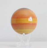 Saturn MOVA globe rotating on acrylic base in solar system themed display video