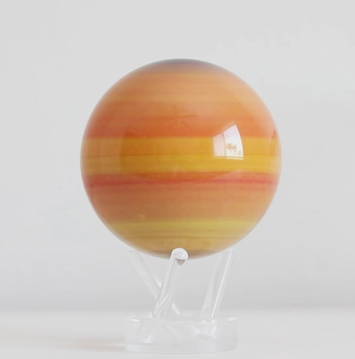 Saturn MOVA globe rotating on acrylic base in solar system themed display video