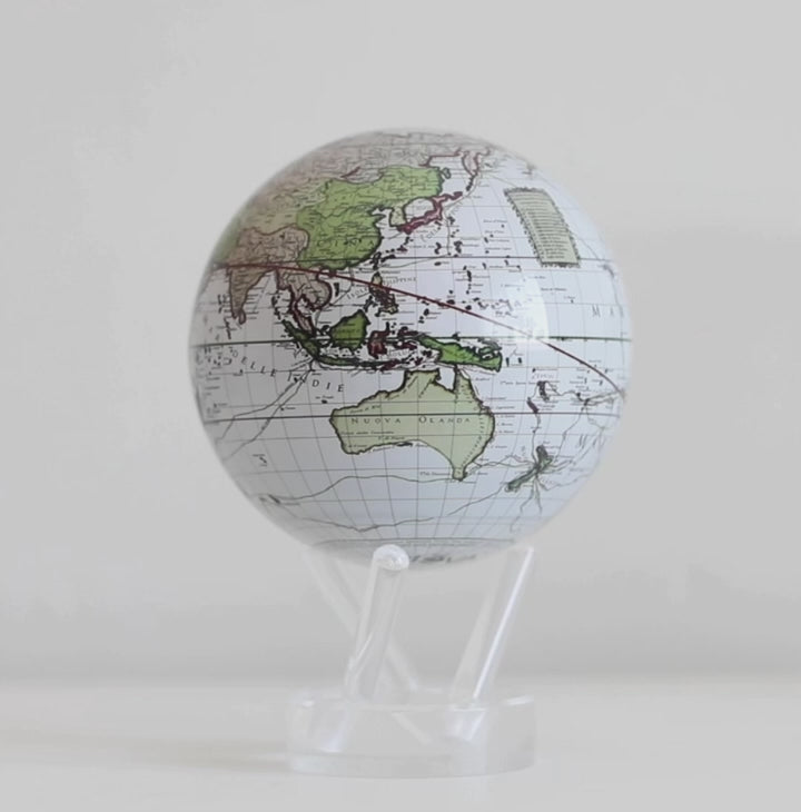 Antique Cassini whiteMOVA globe rotating on acrylic base in celestial themed showcase video