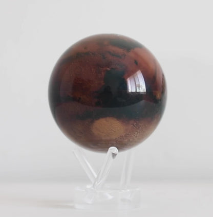 Mars MOVA globe rotating on acrylic base in space themed product display video