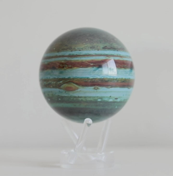 Jupiter MOVA globe rotating smoothly on acrylic base in planetary product showcase video