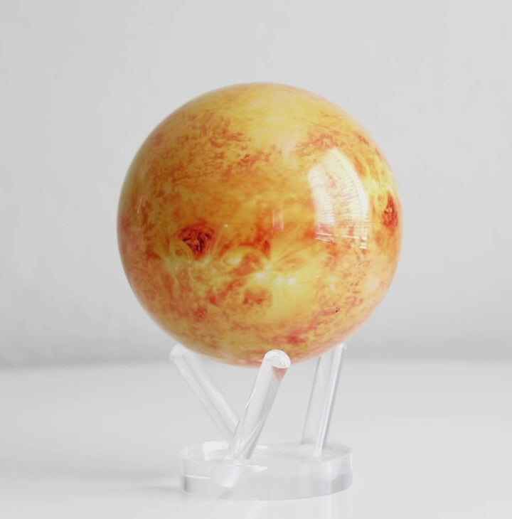 Sun MOVA globe rotating smoothly on acrylic base in space themed product video