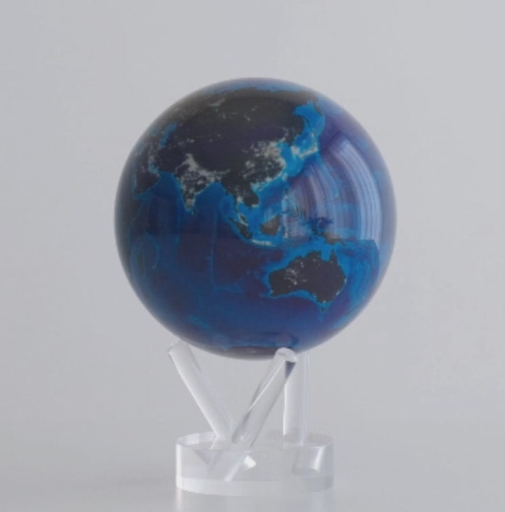 Earth at Night MOVA globe rotating on acrylic base in illuminated world map product video