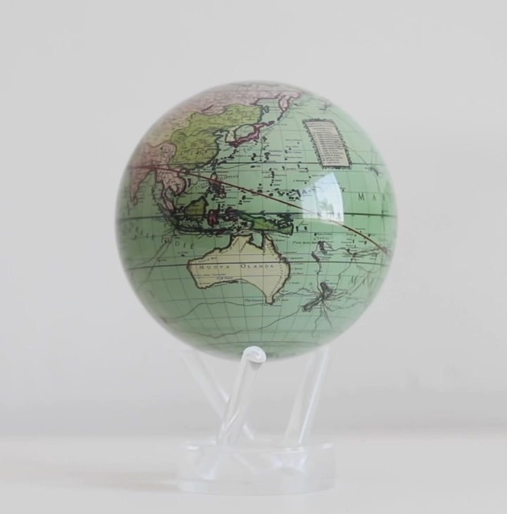 Antique cassini Green MOVA globe rotating on acrylic base in product display video