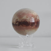 Pluto MOVA globe rotating smoothly on acrylic base in space themed product video