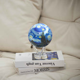 Van Gogh Starry Night MOVA Globe on stacked books, bringing iconic artwork into home decor