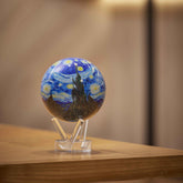 Van Gogh Starry Night MOVA Globe showcasing vibrant blue tones on a wooden tabletop